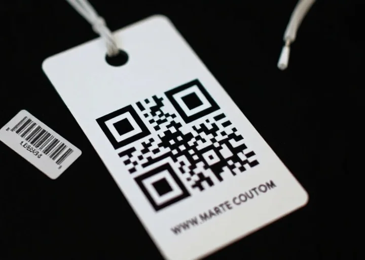 Minimalist QR code clothing hang tag featuring modern apparel branding, smart product label, and custom retail packaging tag design.